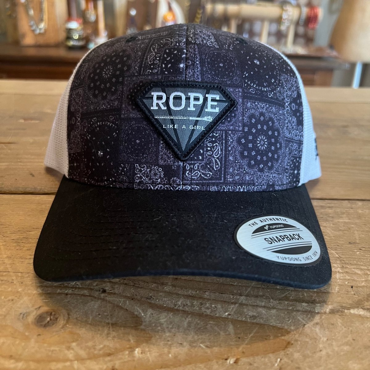 Discover Hooey Rope Like A Girl Black/White Patch & Purple Tinted Bandana Printed Hat SKU: 2349T - BKWH Quality Hooey Hats located at The Revival.