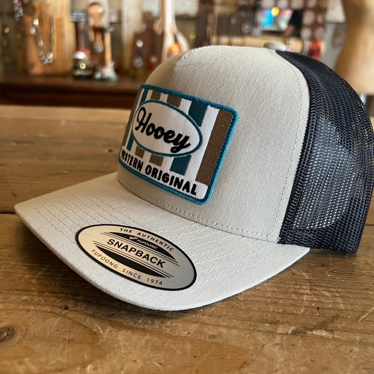 Side angle of Hooey Sudan Tan Charcoal trucker hat - real image